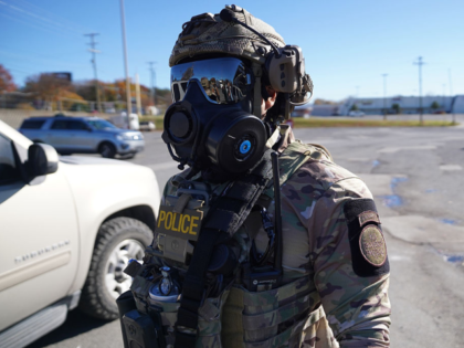 CHARLOTTE, NORTH CAROLINA - NOVEMBER 17: A U.S. Border Patrol agent surveys the parking lo