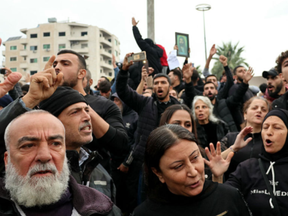 People take part in a protest in al-Azhari Square, following recent attacks against the Al