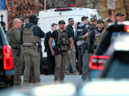 WASHINGTON, DC - NOVEMBER 26: Members of law enforcement respond to a shooting near the Wh