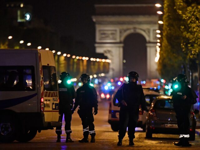 PARIS, FRANCE - APRIL 20: Police officers secure the area after a gunman opened fire on Ch
