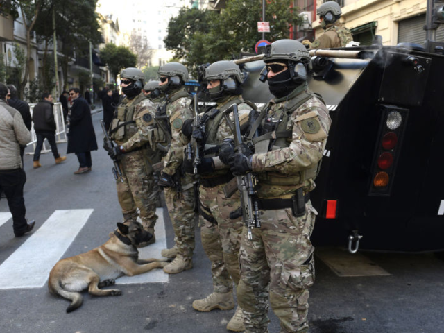 Police special forces stand guard during the commemoration of the terrorist bombing attack