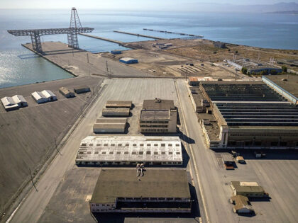 Aerial photos of Hunters Point Naval Shipyard showing Buildings 366 (white on left, middle