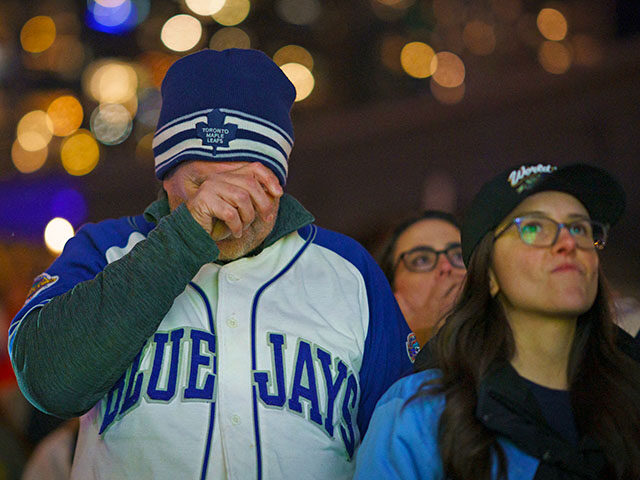 GettyImages2244107393 Blue Jays fans react during a watch party across the street from the Rogers Center where t