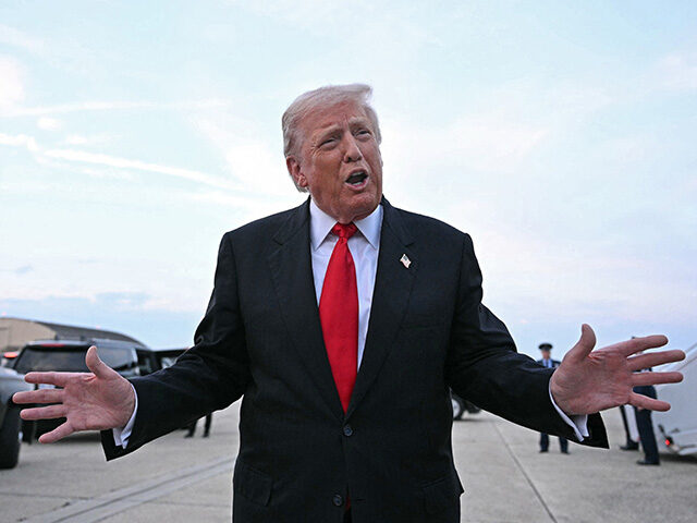 US President Donald Trump speaks with the press upon arrival at Joint Base Andrews in Mary