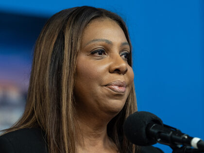 State Attorney General Letitia James speaks before helping to distribute Thanksgiving meal