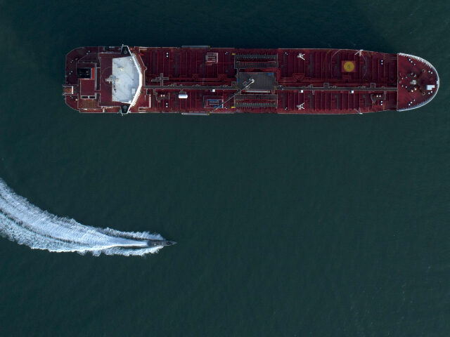 IRGC boat maneuvers near tanker. Pictures from the semi-official Tasnim news agency show the Stena Impero being seized and