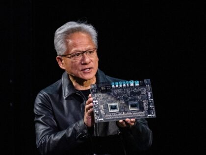Jensen Huang holds up Nvidia hardware