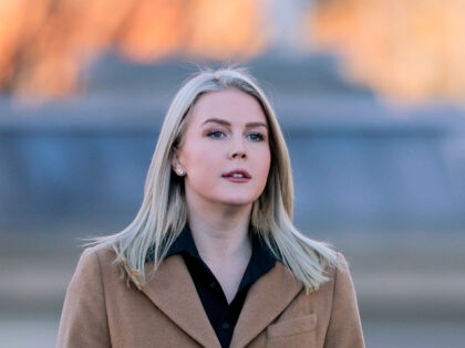 WASHINGTON, DC - NOVEMBER 24: Press Secretary Karoline Leavitt approaches reporters outsid