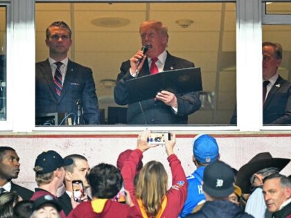 US President Donald Trump (C), alongside US Secretary of Defense Pete Hegseth (L) and Wash
