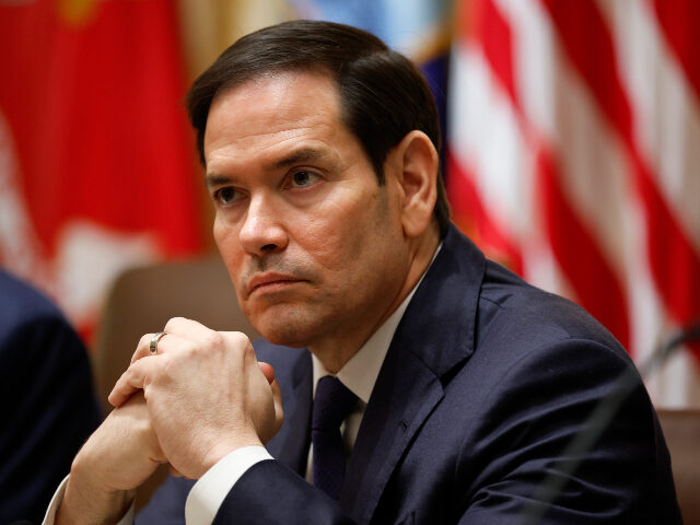U.S. Secretary of State Marco Rubio looks on during a meeting with U.S. President Donald T