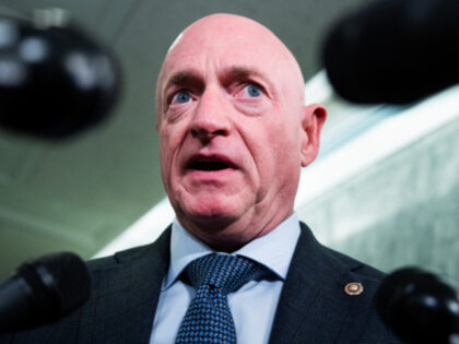 Sen. Mark Kelly, D-Ariz., talks with reporters in Dirksen building on Tuesday, October 28,