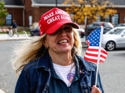 A voter wearing a "Make America Great Again" hat is seen during early voting on