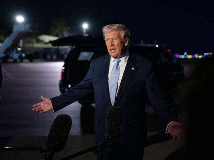 President Donald Trump speaks to the press before boarding Air Force One at Palm Beach Int