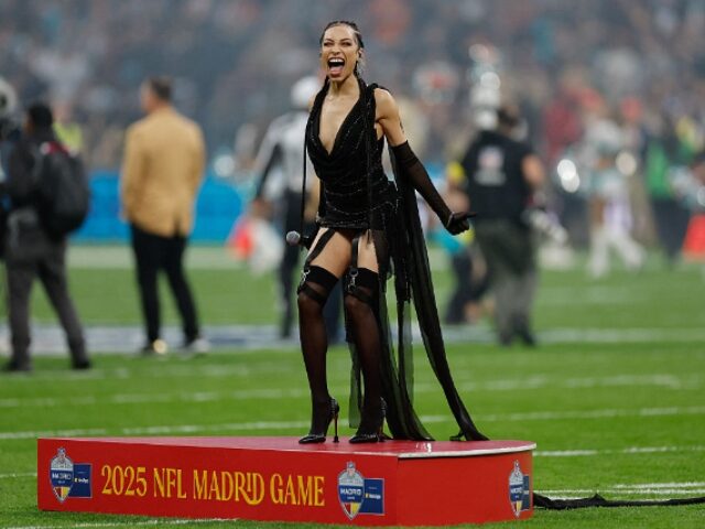 OSCAR DEL POZO_AFP via Getty Images Singer Karina Pasian of the U.S. prepares to perform the national anthem during the NFL ma