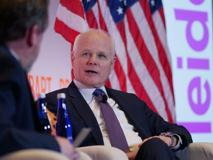Leidos CEO Tom Bell speaks with Breitbart News Economics Editor John Carney during a Breit