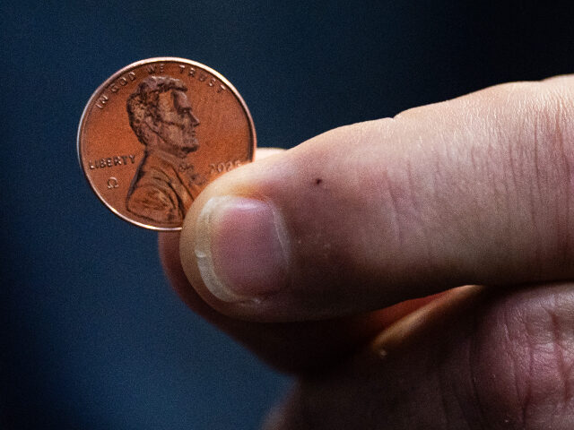 PHILADELPHIA, PA November 12: US Treasurer Brandon Beach presents the last penny made at t