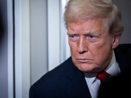 President Donald Trump speaks to the media aboard Air Force One on November 25, 2025 in fl