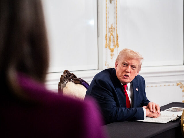 President Donald Trump participates in a call with U.S. service members from his Mar-a-Lag