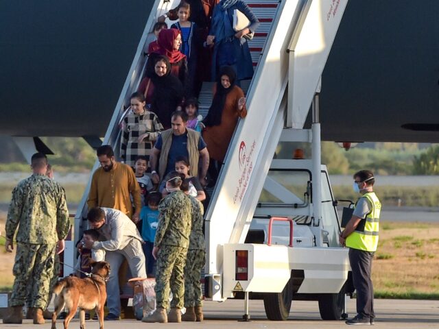 afghans arrive Refugees disembark from a US air force aircraft after an evacuation flight from Kabul at t