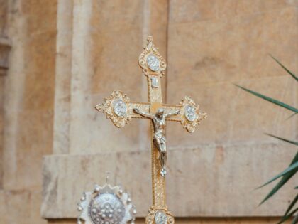A participant carries a cross during the Feast of the Cross in Aleppo, Syria on September