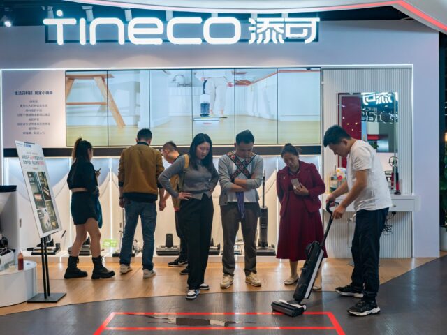 People buy home appliances at the Jingdong Electric Super Experience Store in Chongqing, C