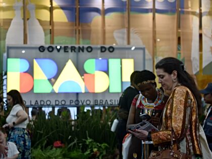 BELEM, BRAZIL - NOVEMBER 10: Attendees communicate with each other outside the venue of th