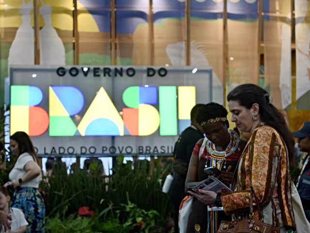 cop30 venue BELEM, BRAZIL - NOVEMBER 10: Attendees communicate with each other outside the venue of th