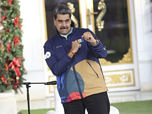 danbcing man maduro CARACAS, VENEZUELA - NOVEMBER 21: Venezuela's President Nicolas Maduro dances during the s