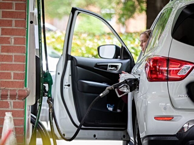 gas tank A lucky motorist manages to fill his gas tank at a Circle K near uptown Charlotte, North C