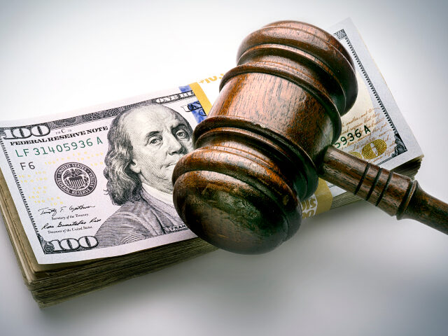 gavel on a stack of money