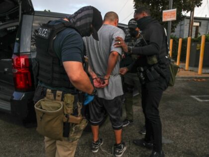 Los Angeles, CA - September 08: Immigration and Customs Enforcement agents apprehend an an