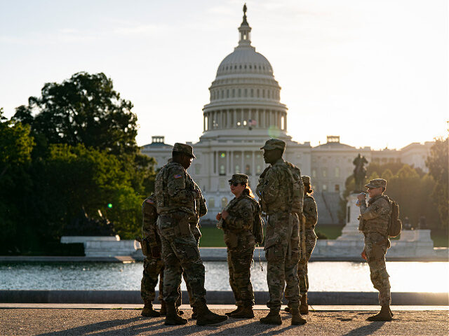 WASHINGTON, DC - OCTOBER 1: Members of the National Guard patrol near the U.S. Capitol on