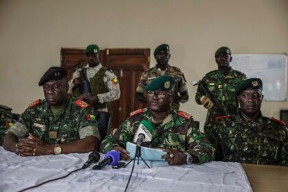 Brigadier General Denis N'Canha (C), head of the military office of the presidency, g