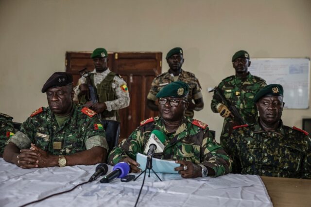 Brigadier General Denis N'Canha (C), head of the military office of the presidency, g