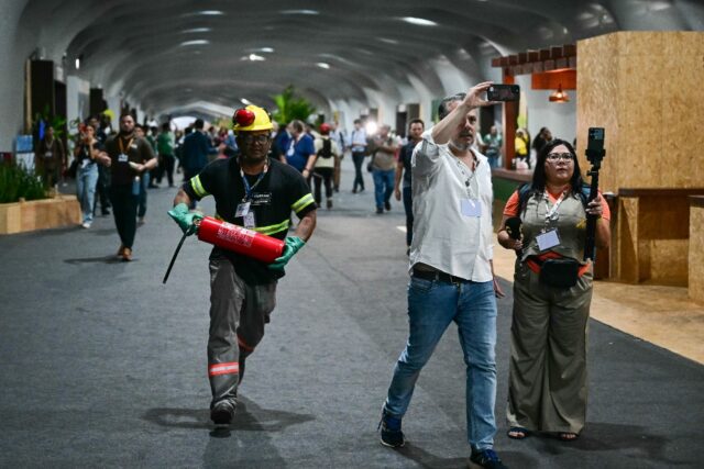 Delegates are set to resume their negotiations after a dramatic fire on Thursday afternoon