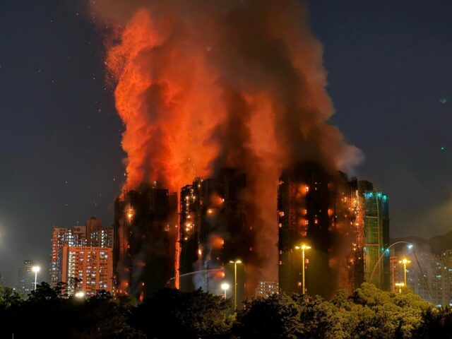 A major fire engulfs several apartment blocks in Hong Kong with at least four people kille