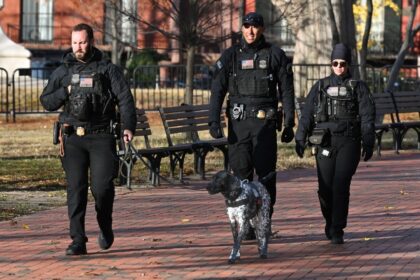 Secret Service officers patrol across from the White House, in Washington, DC on November