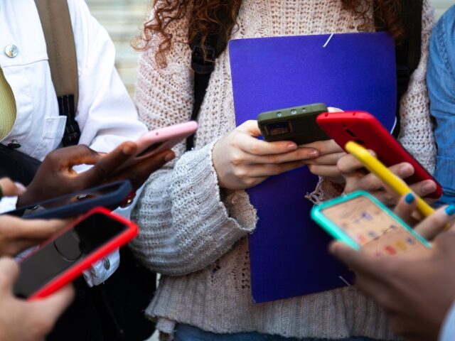 young teens glued to their phone