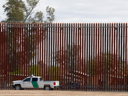 VIDEO: Two Migrant Women Fall While Climbing Border Wall in California (AP Photo/Jacquelyn