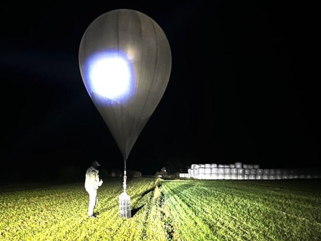 FILE - In this undated photo released by the State Border Guard Service, an officer inspec