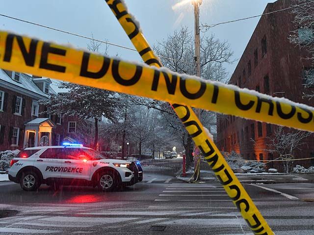 Title: Brown University Shooting Image ID: 25348453464449 Article: A police vehicle is par
