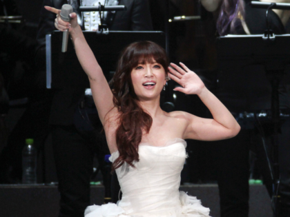 Singapore pop singer JJ Lin, righy, performs with Japanese singer Ayumi Hamasaki during hi