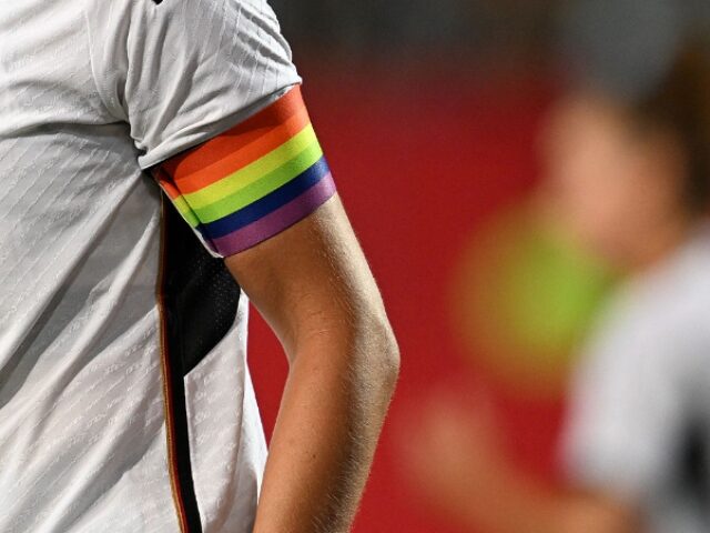 CHRISTOF STACHE_AFP via Getty Images Germany's midfielder Alexandra Popp wears the colored captain's armband during t
