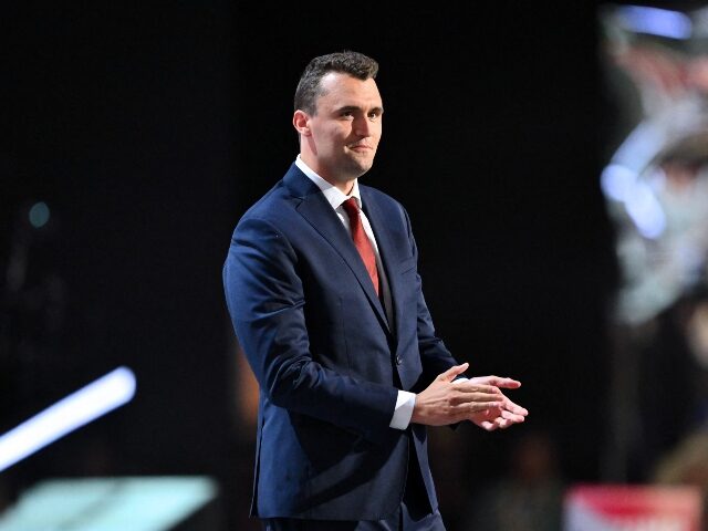 Charlie Kirk applauds his supporters