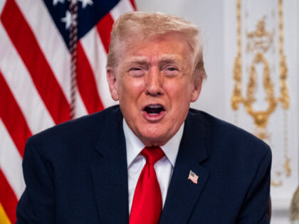 President Donald Trump participates in a call with U.S. service members from his Mar-a-Lag