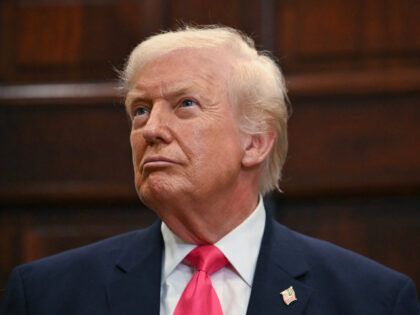 US President Donald Trump looks on during an announcement of a $6.25 billion donation from