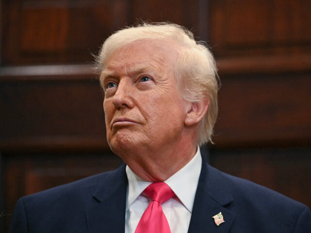 US President Donald Trump looks on during an announcement of a $6.25 billion donation from