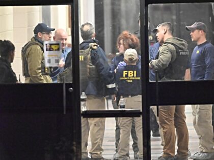 FBI brown PROVIDENCE, RHODE ISLAND - DECEMBER 13: Members of the FBI Evidence Response Team work at