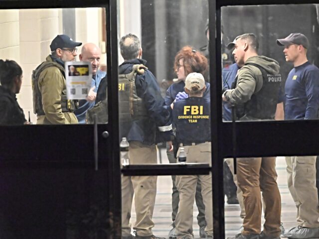 FBI brown PROVIDENCE, RHODE ISLAND - DECEMBER 13: Members of the FBI Evidence Response Team work at