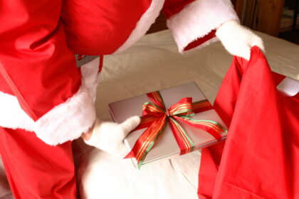 Santa Putting Laptop Into Sack